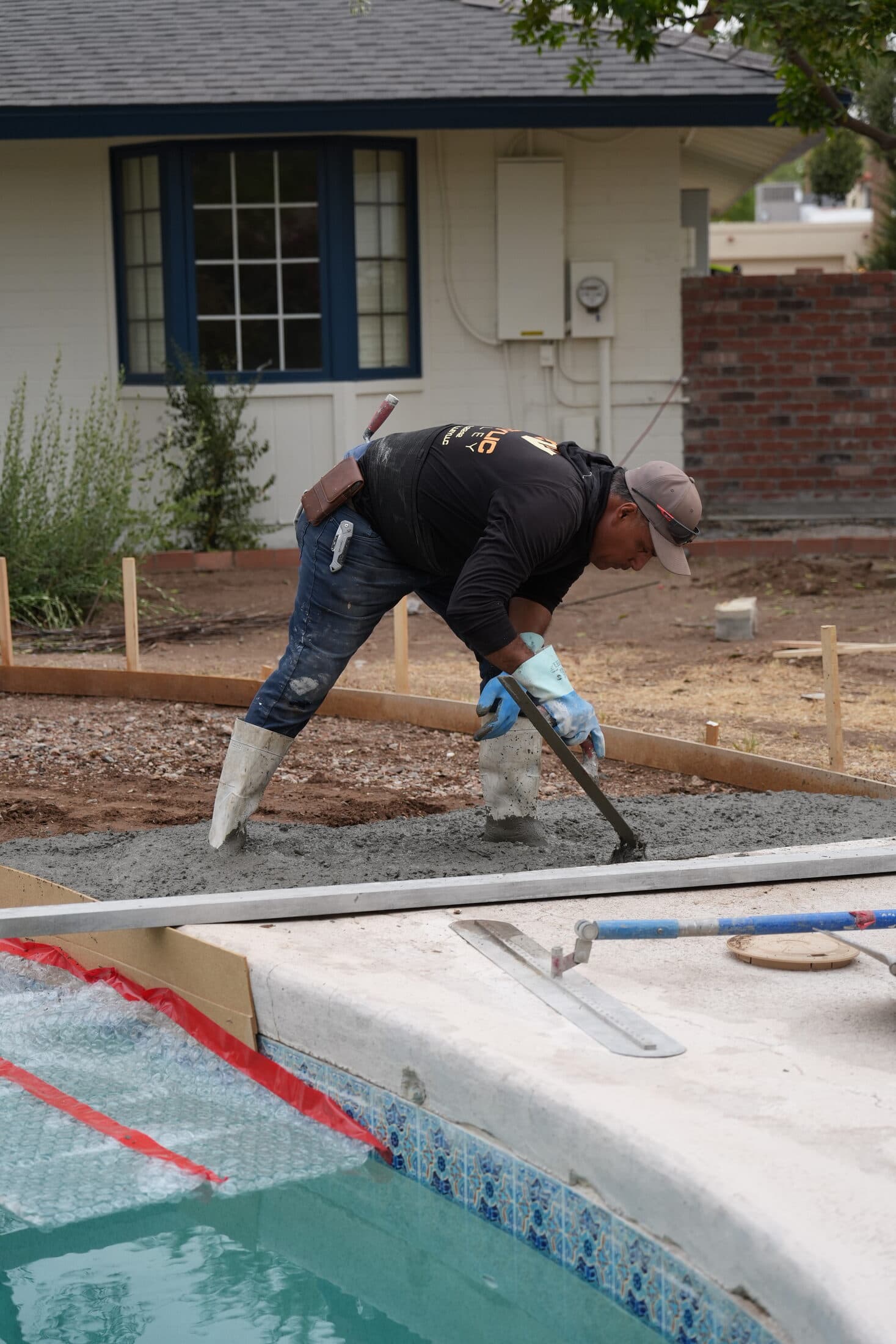 Acrylic Valley crew member finishing a concrete pool deck edge